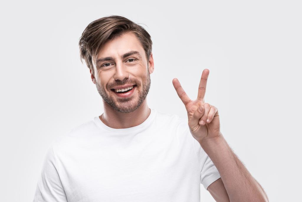 man showing victory sign - Photo, Image