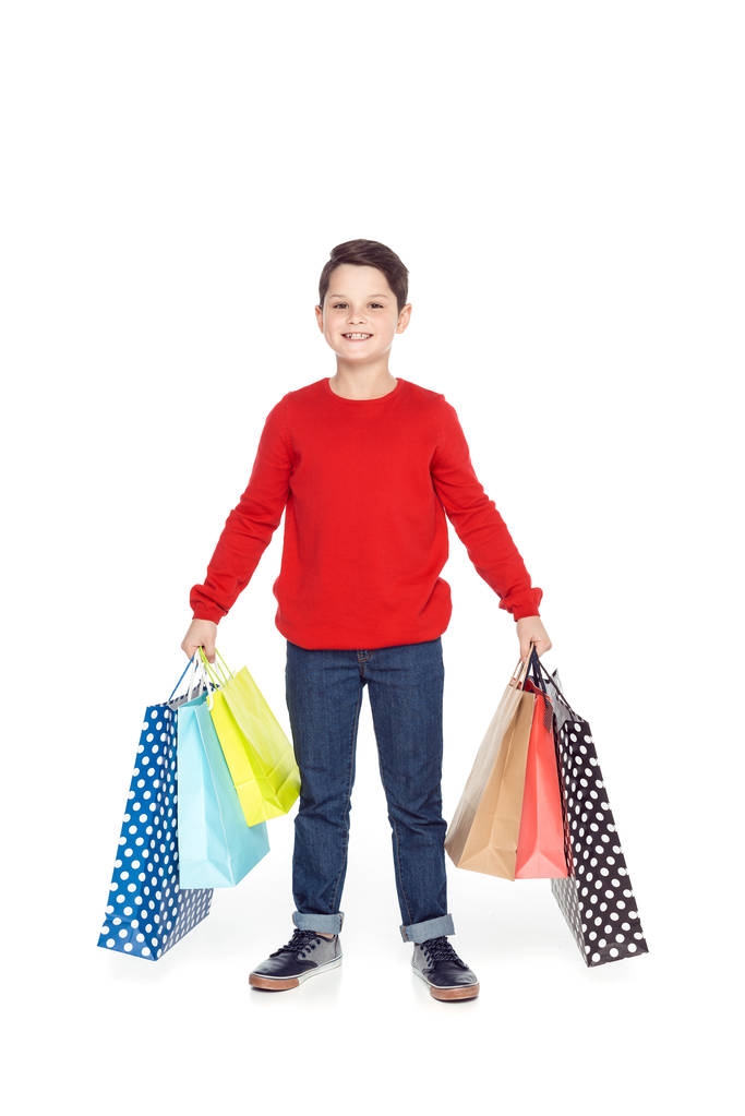 menino com sacos de compras
 - Foto, Imagem