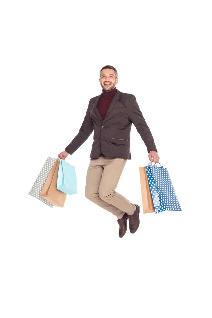 man jumping with shopping bags - Photo, Image