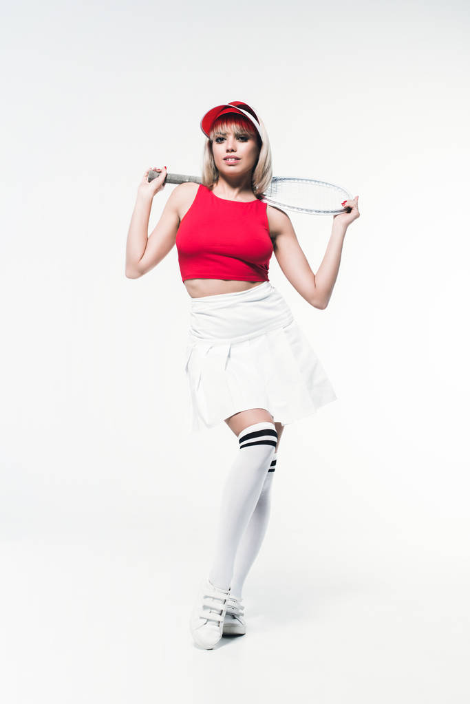 жінка в спортивному одязі з тенісною ракеткою
 - Фото, зображення