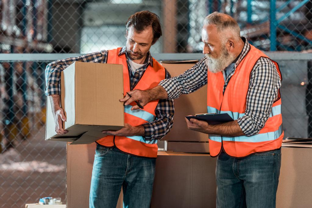 warehouse workers with clipboard  - Photo, Image