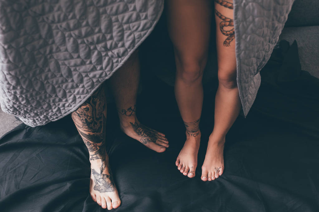 tattooed couple covered in blanket - Photo, Image