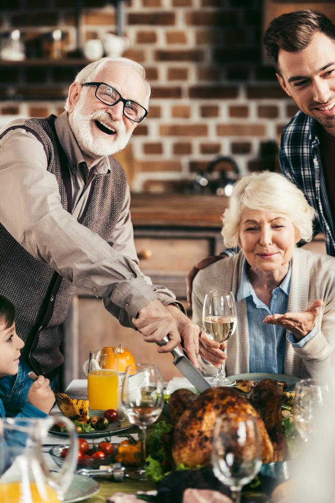family cutting thanksgiving turkey - Photo, Image