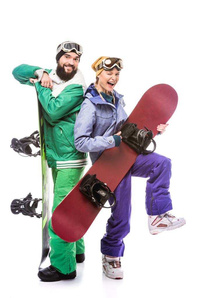 pareja en trajes de snowboard con tablas de snowboard
 - Foto, Imagen