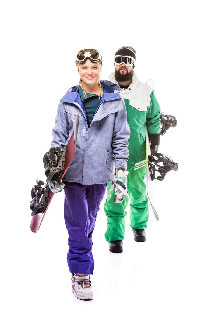 pareja en trajes de snowboard con tablas de snowboard
 - Foto, imagen