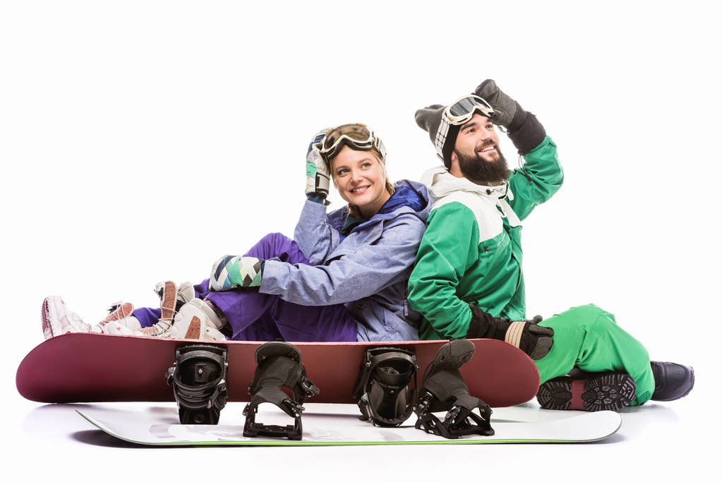 casal em trajes de snowboard com snowboards
 - Foto, Imagem
