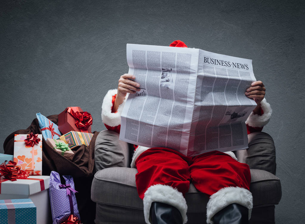 Santa Claus reading business news - Photo, Image