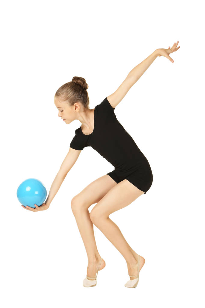 Молодая гимнастка с мячом на белом фоне
 - Фото, изображение