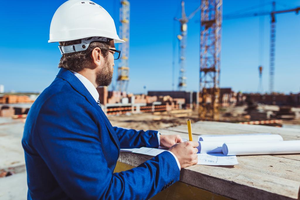 Businessman working at construction site - Photo, Image
