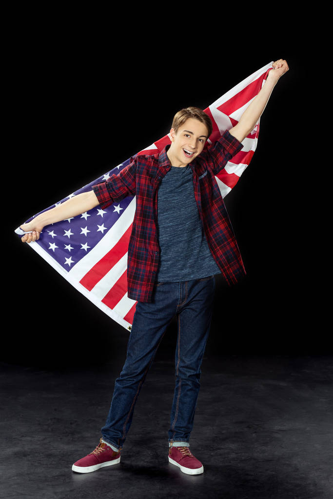 хлопчик-підліток з прапором США
 - Фото, зображення
