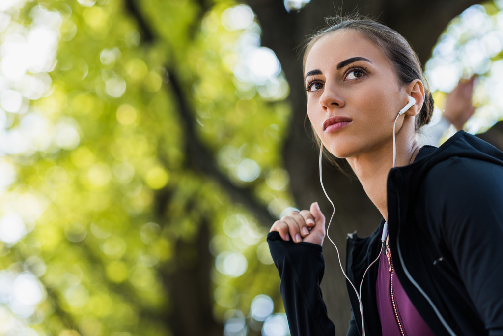 woman listening music in park - Photo, Image