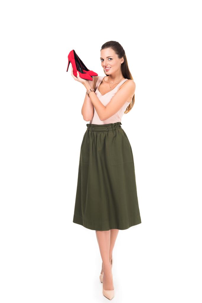 žena držící červené boty - Fotografie, Obrázek