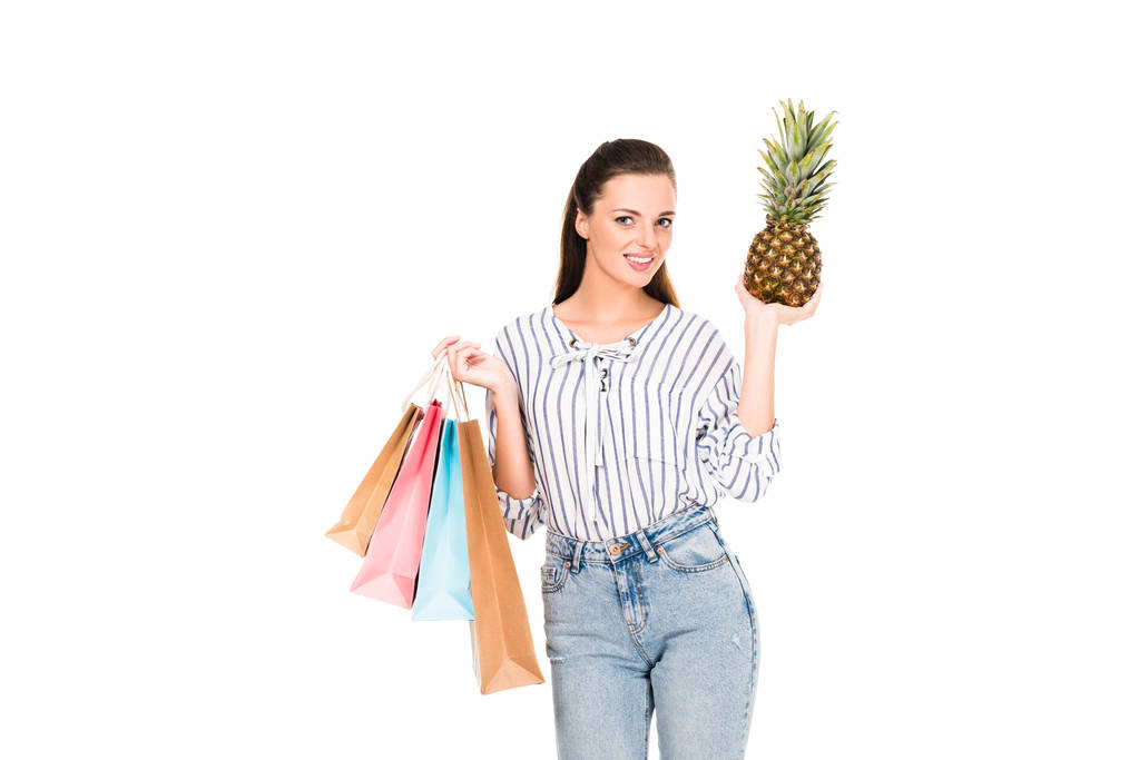 woman with pineapple and shopping bags - Photo, Image