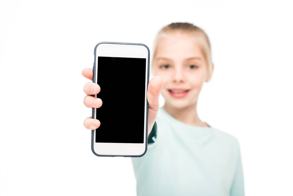 Niño sosteniendo smartphone
 - Foto, Imagen
