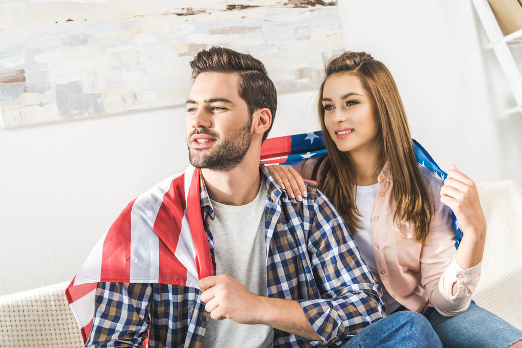 couple wrapped in American flag - Photo, Image