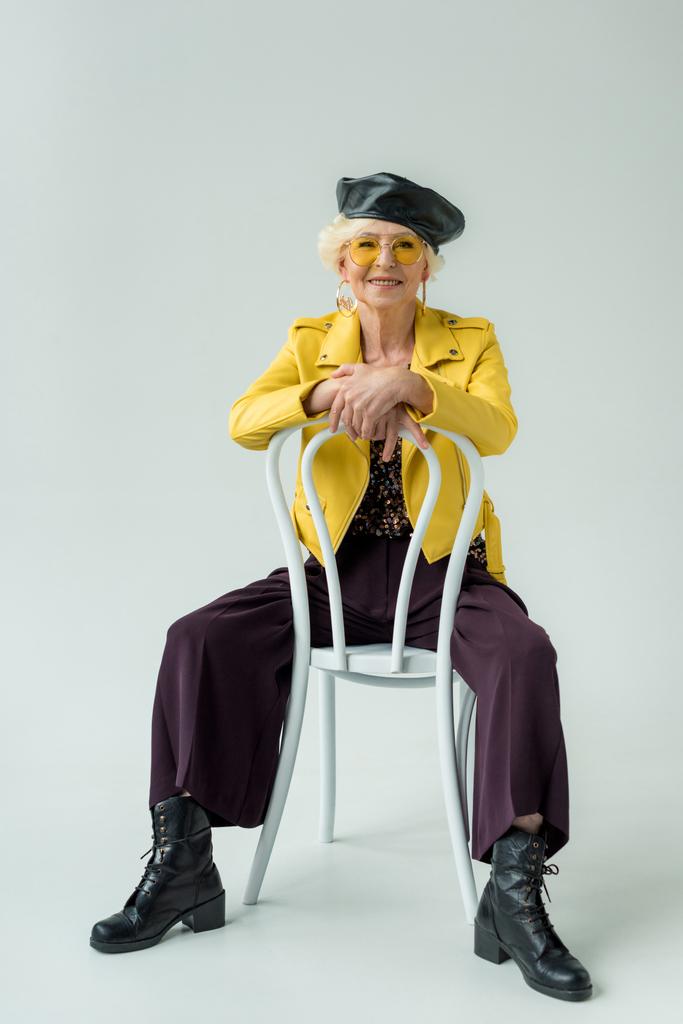 fashionable senior woman sitting on chair - Photo, Image