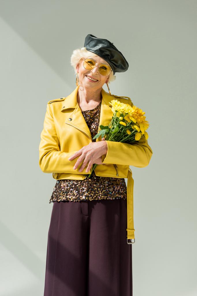 stylish senior woman with flowers - Photo, Image