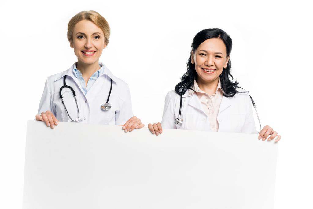 médicos con pancarta en blanco
 - Foto, Imagen