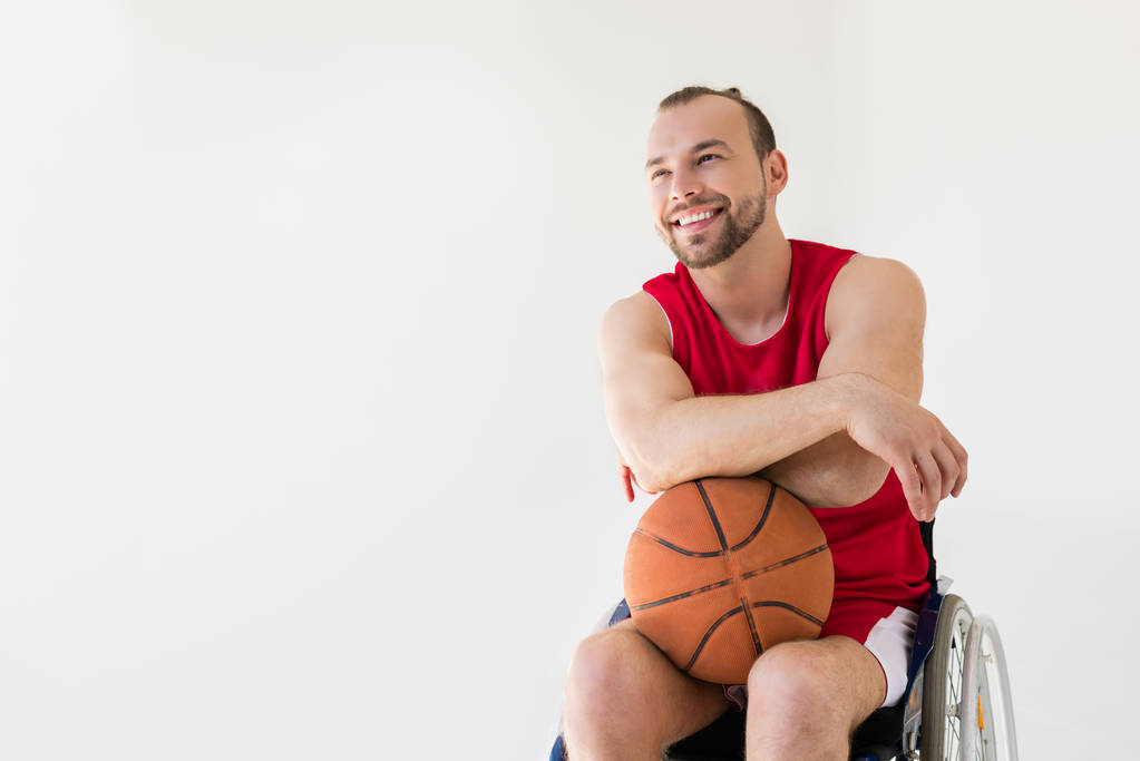 車椅子バスケット ボールを保持しているスポーツマン - 写真・画像