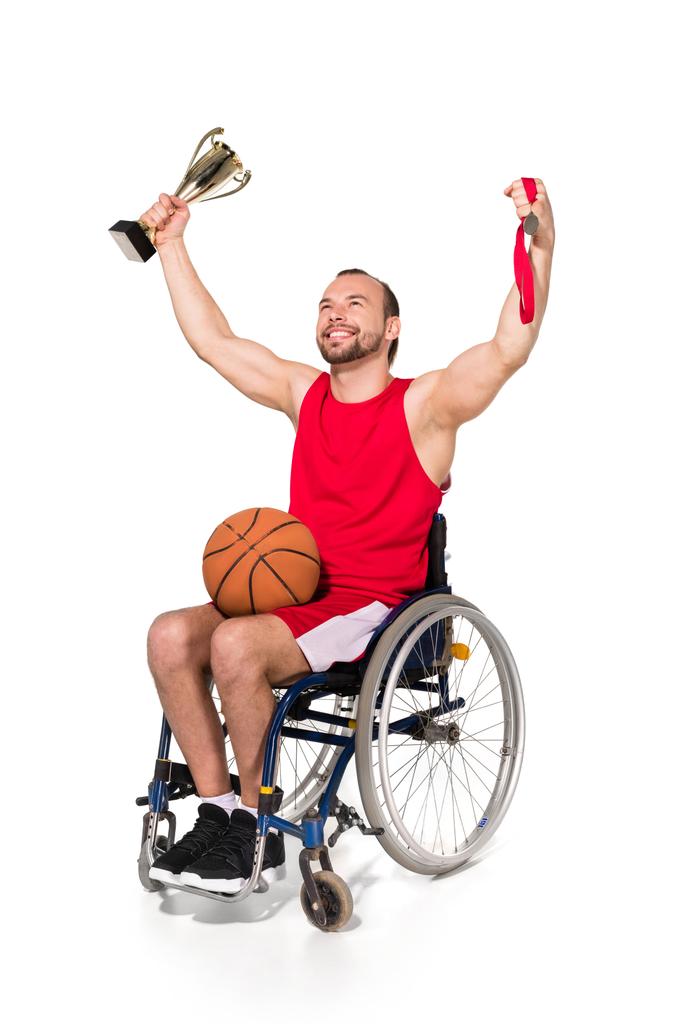 Sportsman in wheelchair with trophies   - Photo, Image