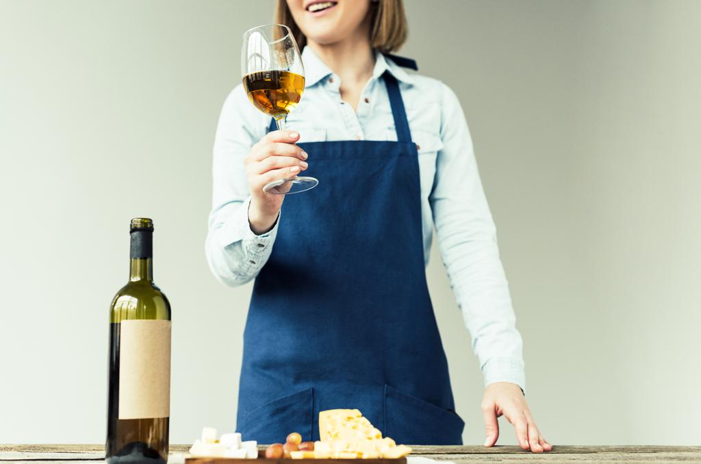 sommelier holding glass of white wine - Photo, Image