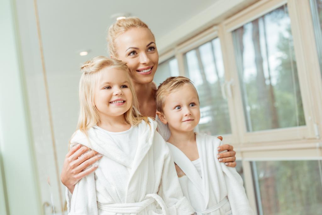 mother and children in bathrobes - Photo, Image