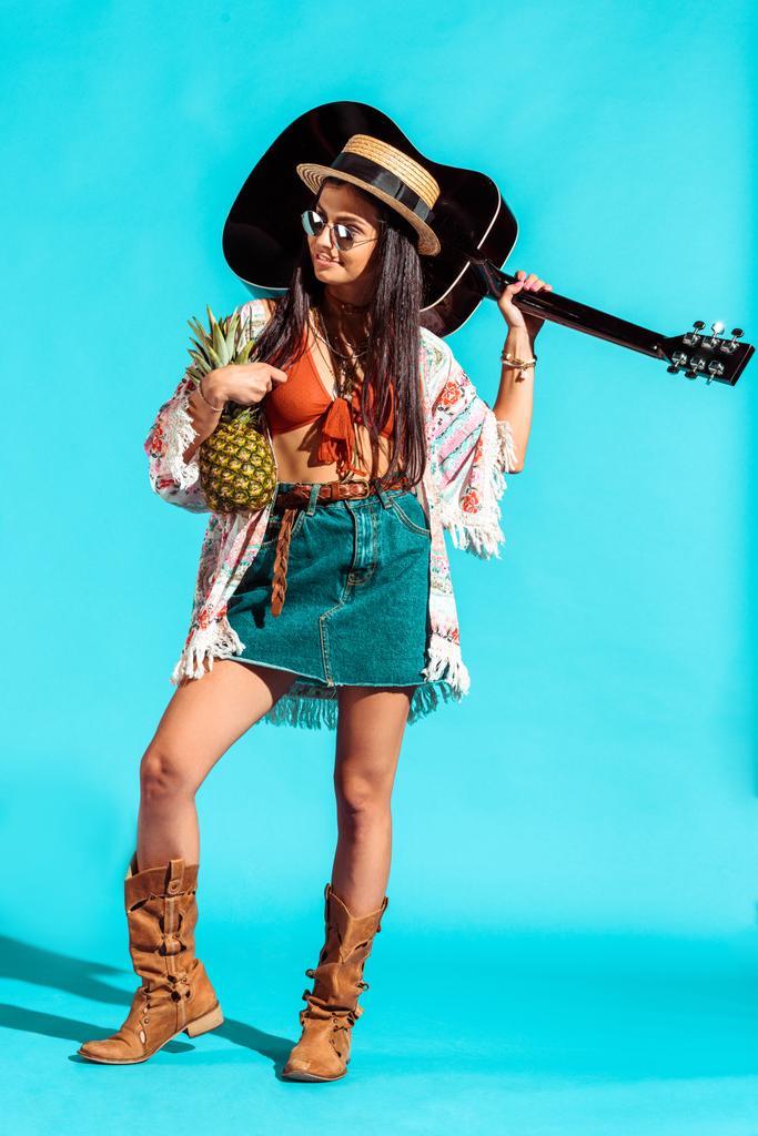 woman standing with pineapple and guitar  - Photo, Image