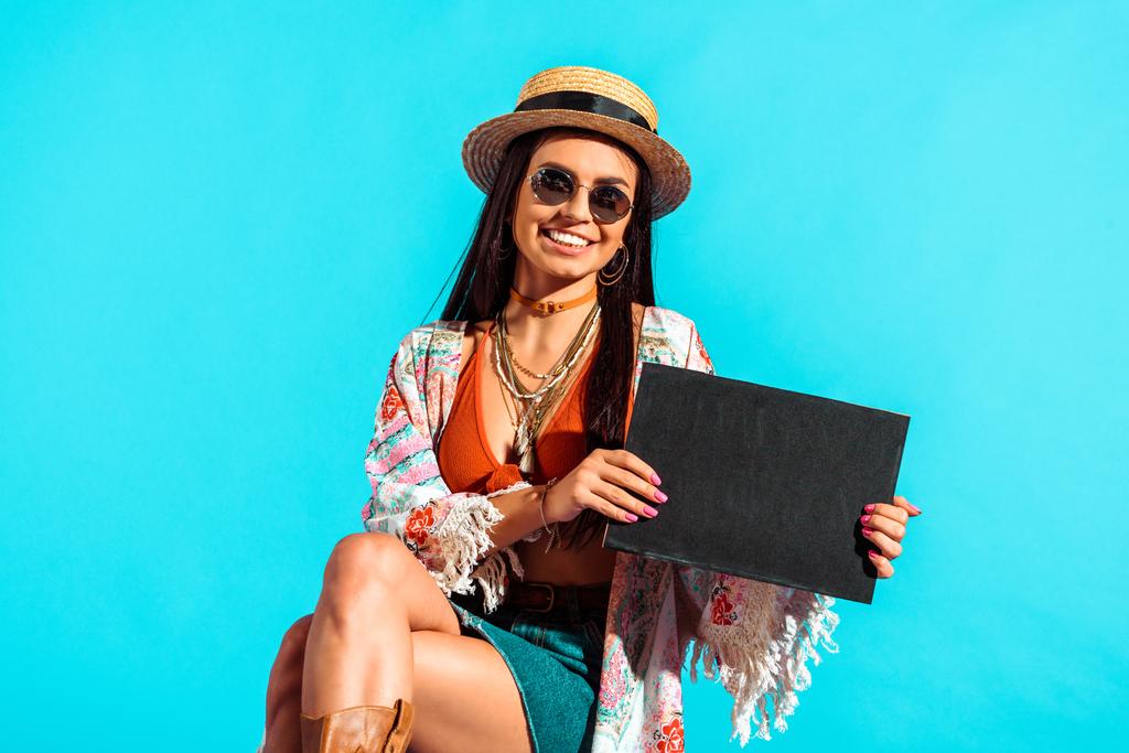 Hippie tourist holding black board - Photo, Image