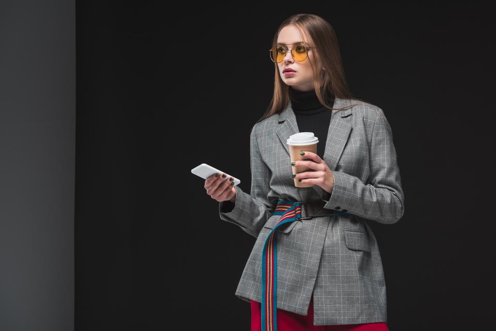 woman standing with smartphone and cup of coffee - Photo, Image