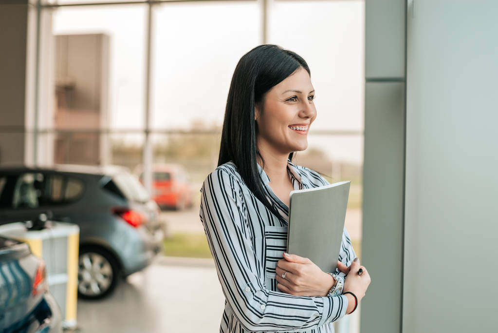 car saleswoman holding clipboard  - Photo, Image