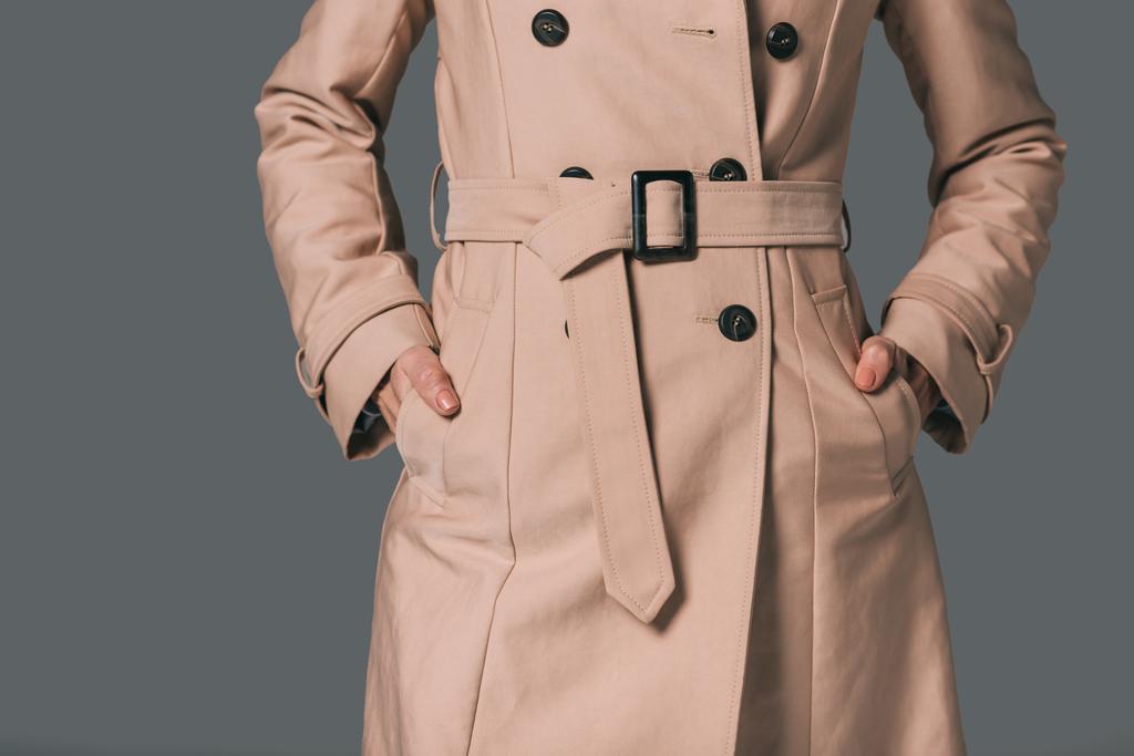 Mulher de casaco de trincheira
 - Foto, Imagem
