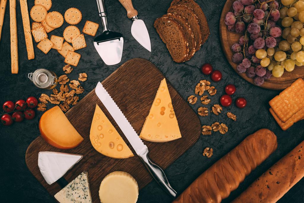 various cheese types, bread and grapes - Photo, Image