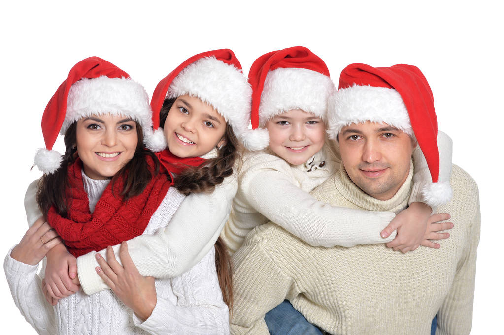 famille avec enfants en chapeaux de Père Noël
 - Photo, image