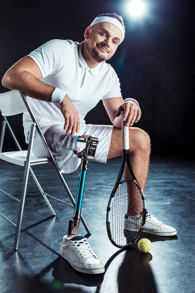 paralympic tennis player resting on chair - Photo, Image