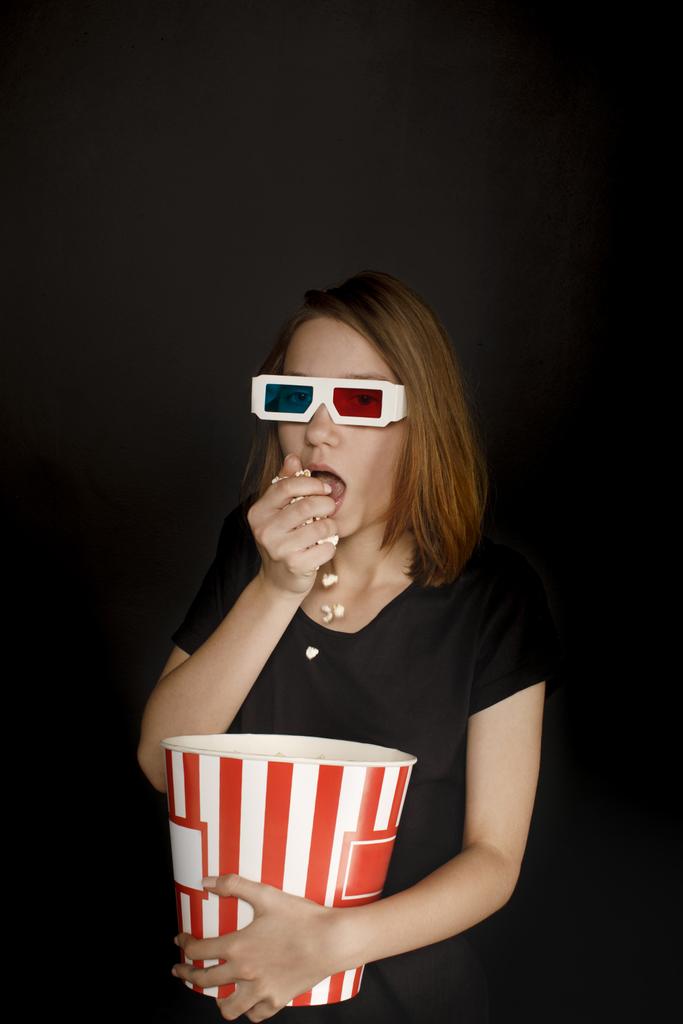 woman in 3d glasses eating popcorn - Photo, Image
