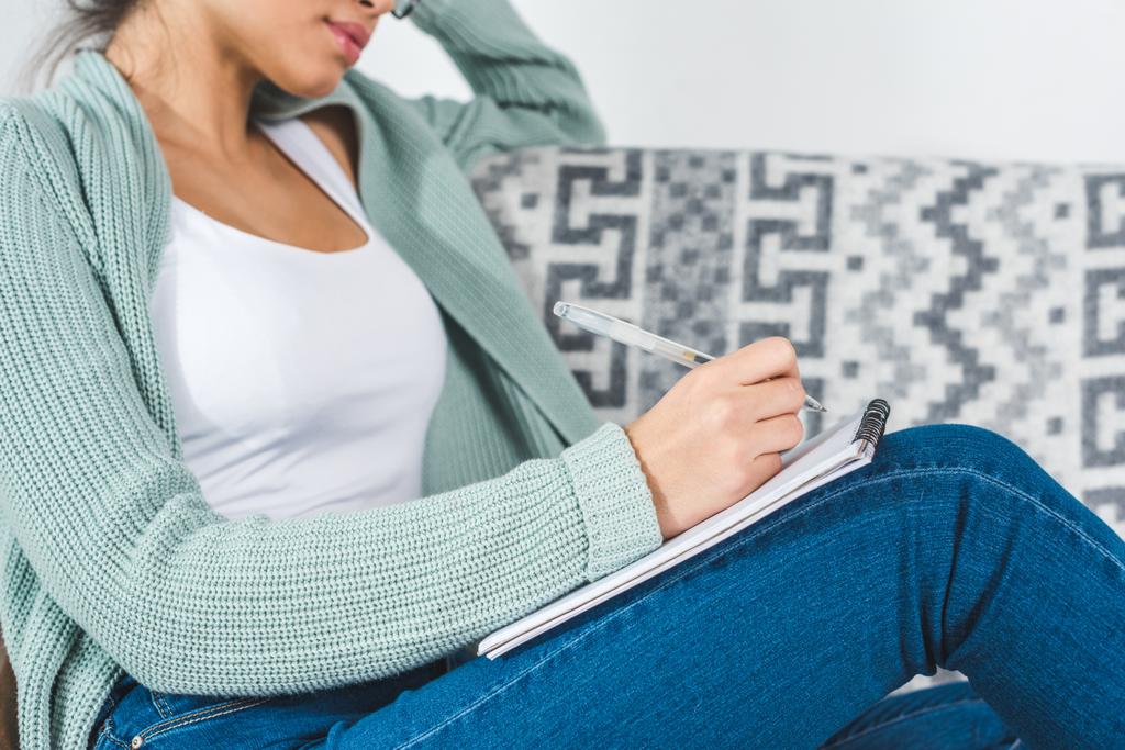 girl with notebook at home - Photo, Image