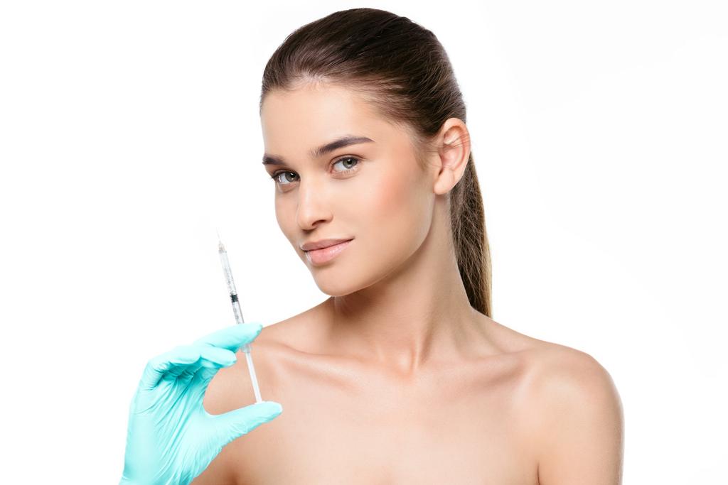 mulher com seringa injectável
 - Foto, Imagem