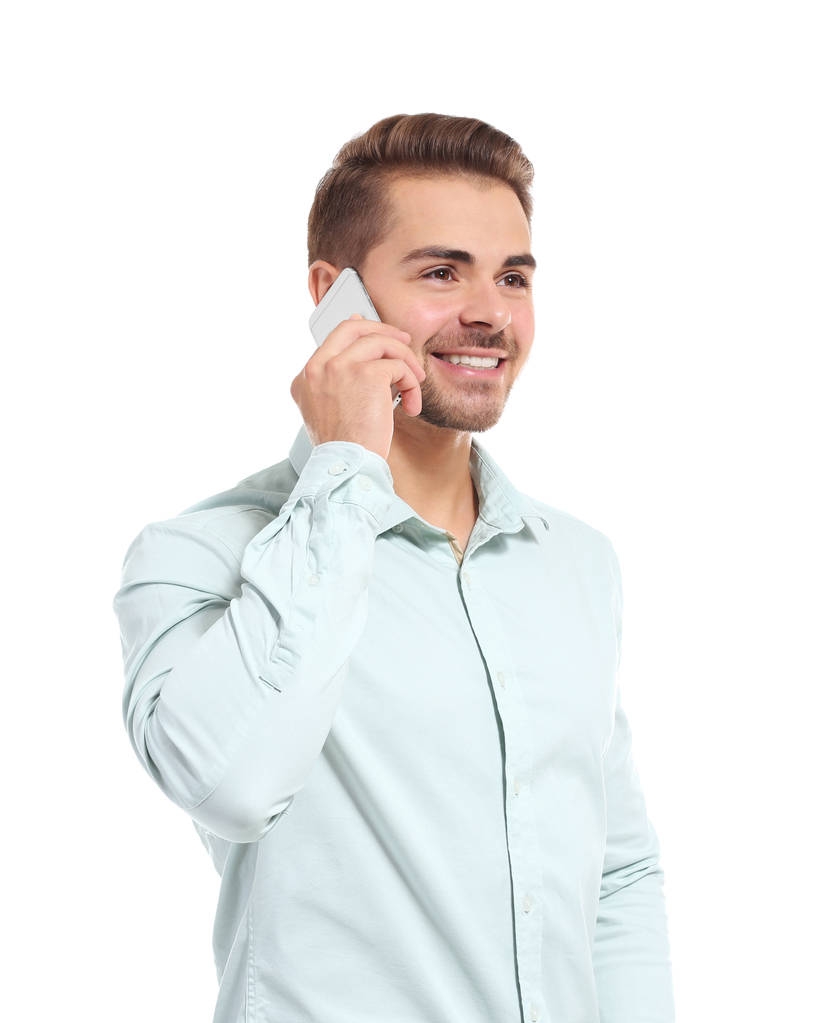 Joven hombre guapo hablando en su teléfono móvil
 - Foto, imagen