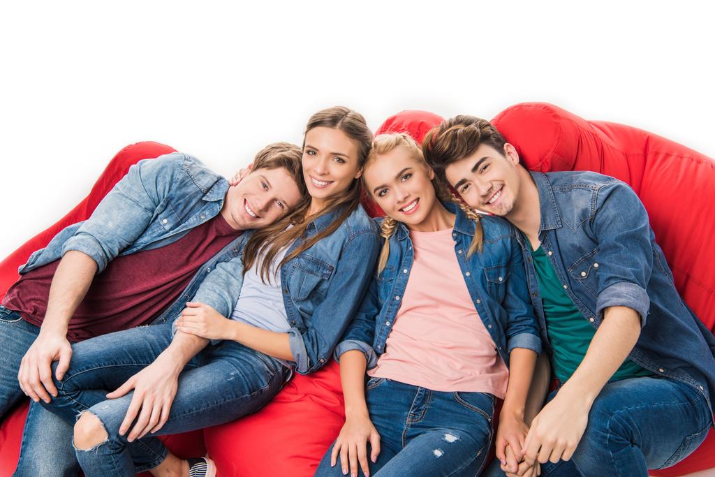 friends sitting on bean bag chairs - Photo, Image