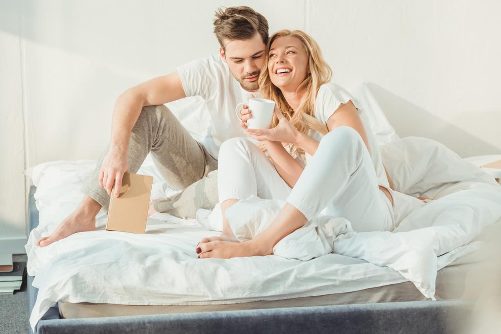 couple drinking coffee in bed - Photo, Image