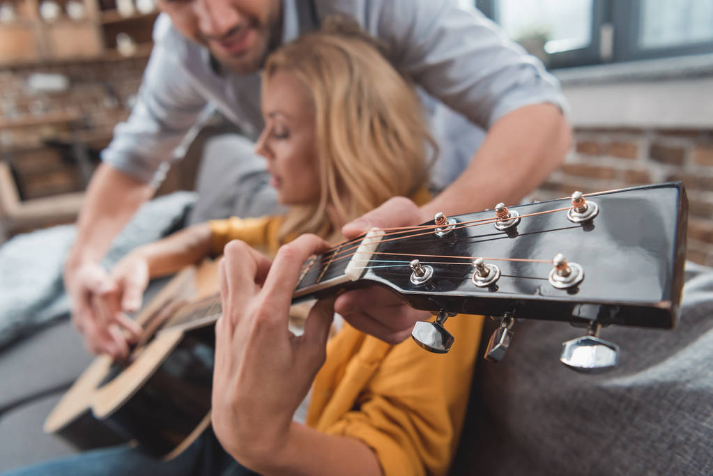 man learning girlfriend to play guitar - Photo, Image