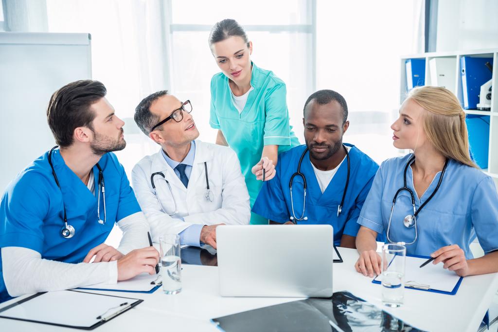doctors brainstorming and using laptop - Photo, Image