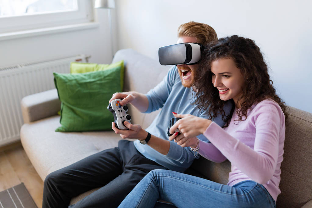 young couple playing video games - Photo, Image