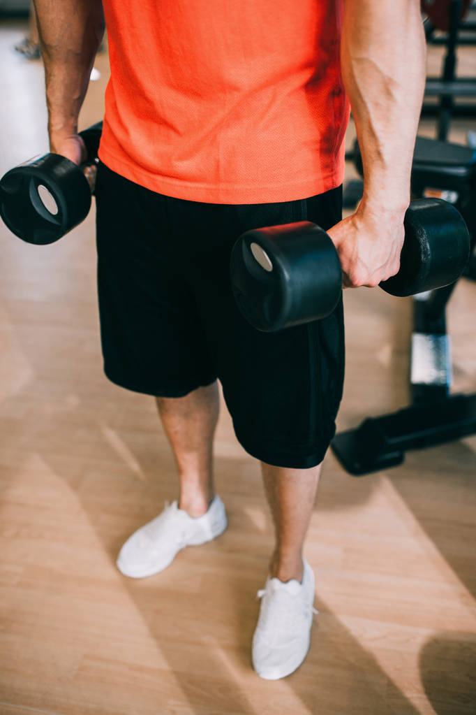 Dumbbells training workout man gym concept. - Photo, Image