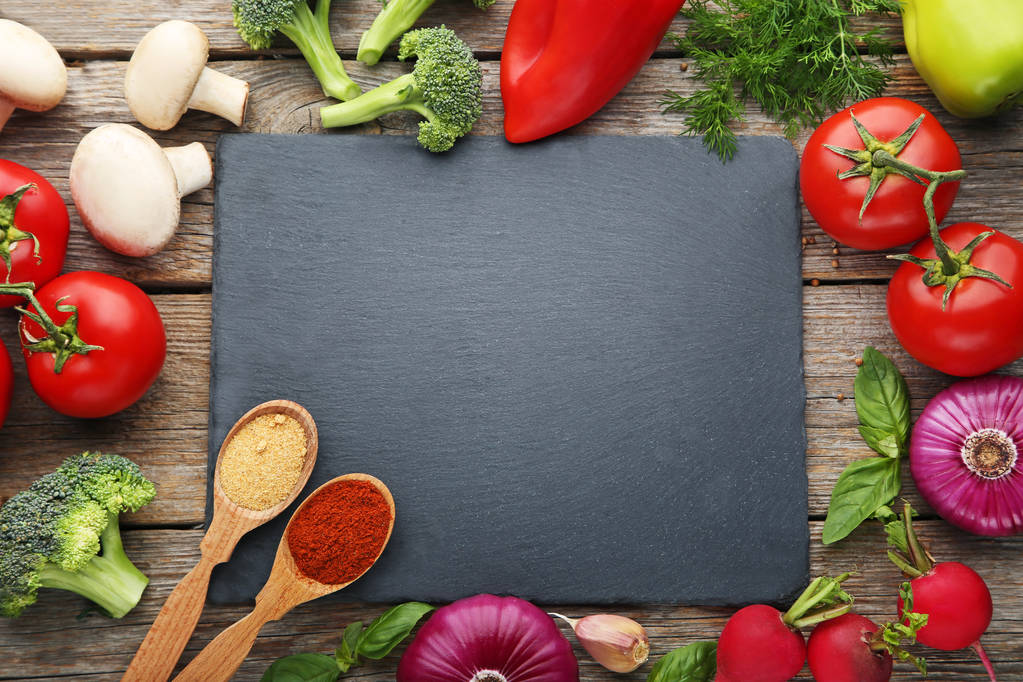Black cutting board with vegetables  - Photo, Image