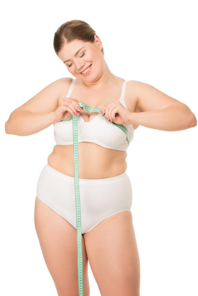 太りすぎの女性の胸を測定 - 写真・画像