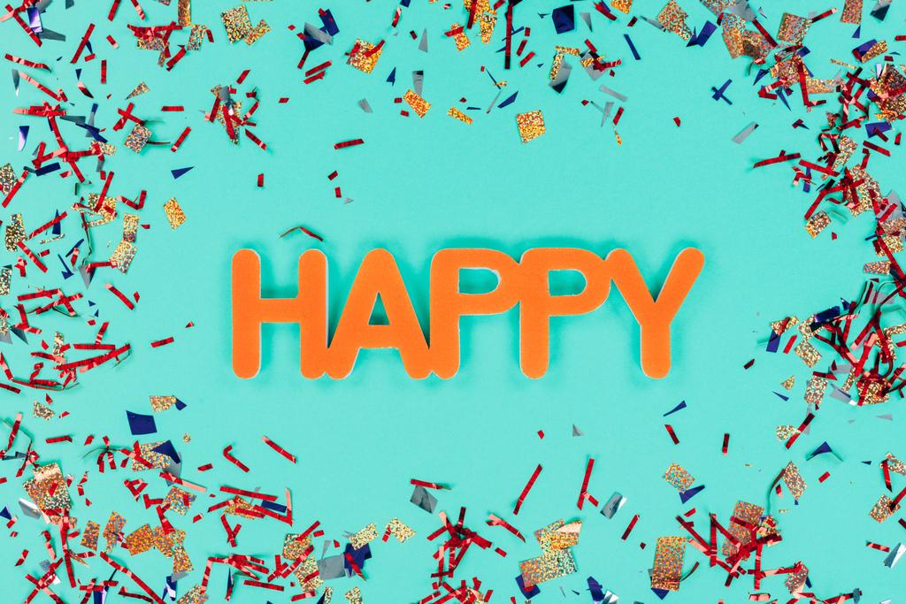 happy sign surrounded with confetti - Photo, Image