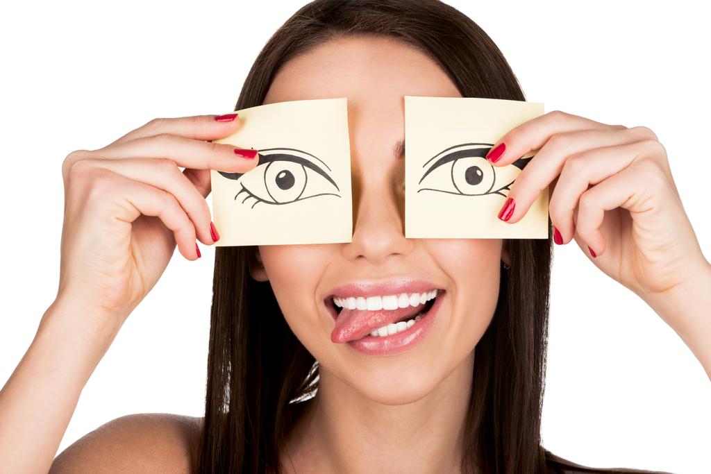 woman covering eyes with stickers - Photo, Image
