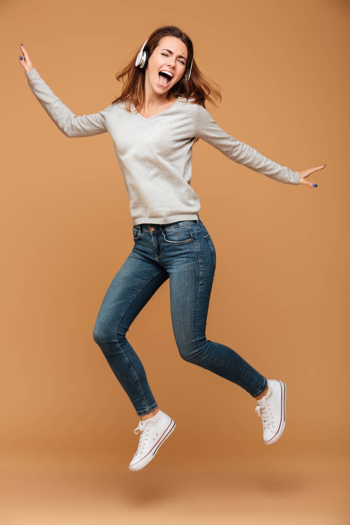 Full length photo of joyful pretty girl in casual wear jumping w - Photo, Image