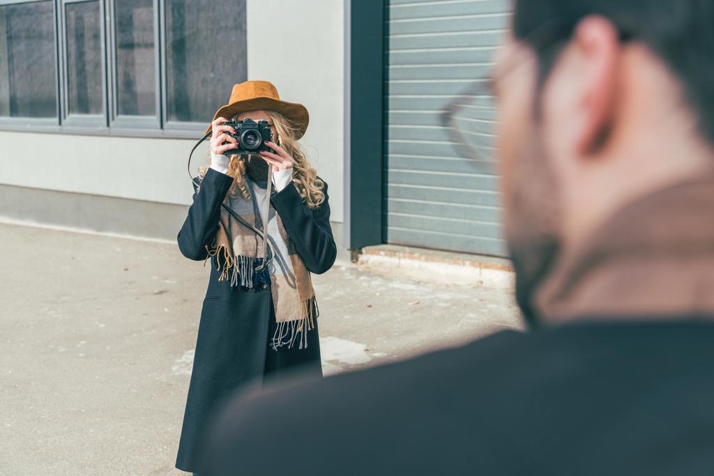 woman with camera photographing boyfriend - Photo, Image